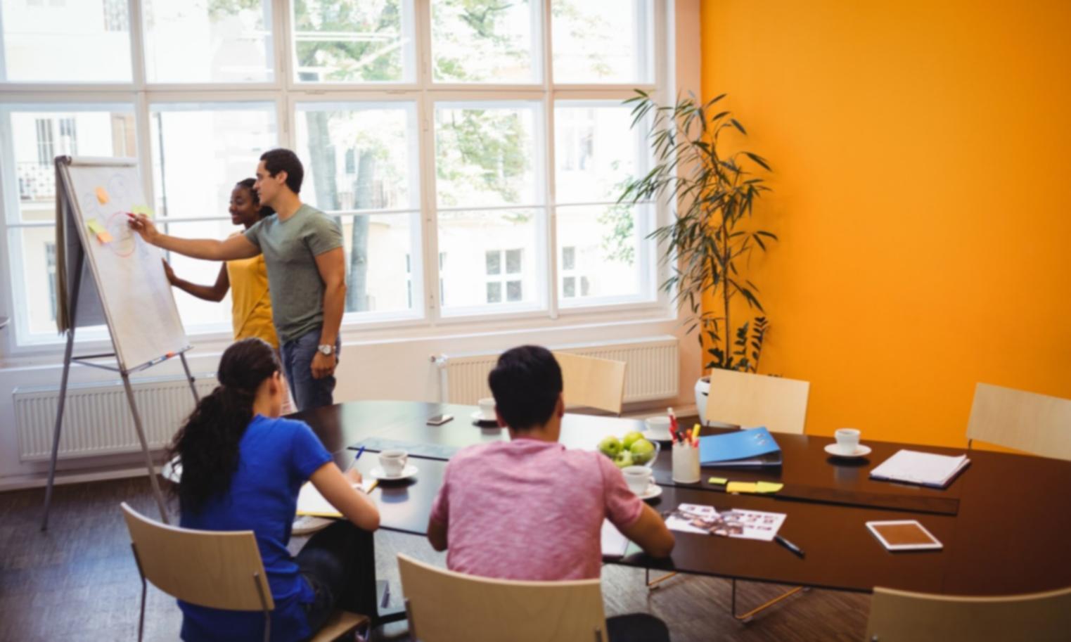 Business meeting discussing financial projections and strategy