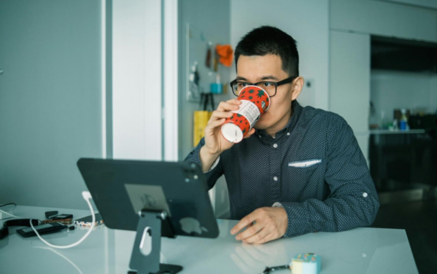 Financial planning workspace with laptop, calculator, and business documents spread across desk